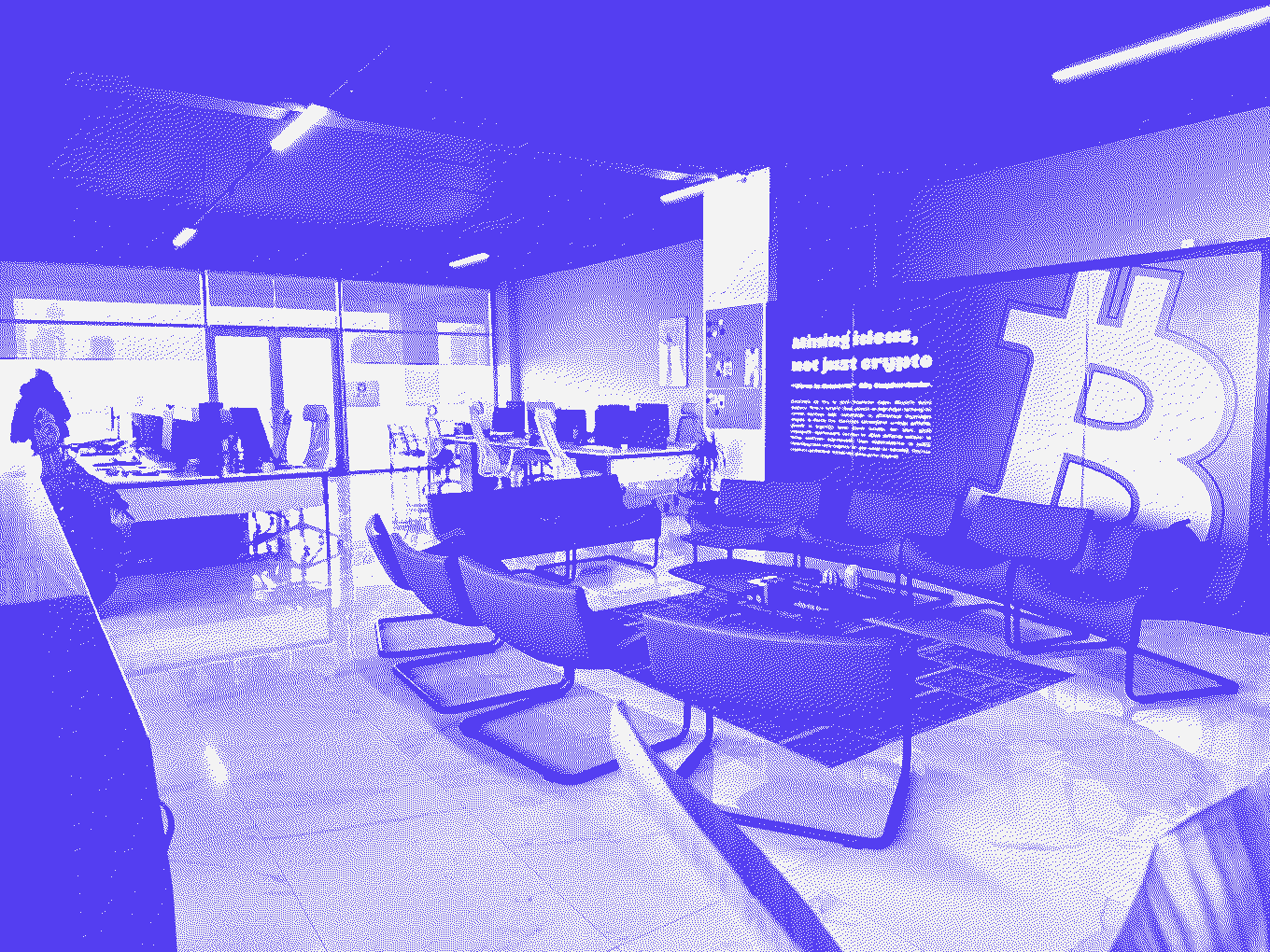 The Vinu Digital office lounge under the “Mining ideas, not just crypto” wall